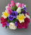 Cemetery pot with artificial magenta peonies and purple pansies