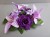 Candle ring with artificial purple roses & lilies