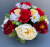 Pot for memorial vase with red roses and yellow peonies
