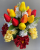 Cemetery pot with red yellow orange tulips