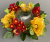 Candle ring with artificial mustard poppies and daisies