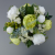Centerpiece for wedding table with artificial ivory roses & green peonies