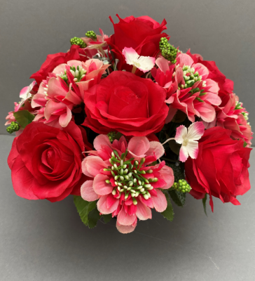 Pot for memorial vase with artificial red roses and pink scabiosa