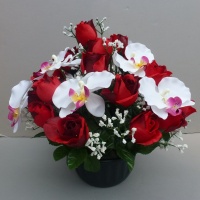 Large freestanding artificial flower pot with red rosebuds and white orchids